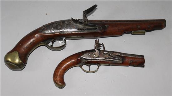 A flintlock service pistol and a Continental flintlock overcoat pistol,
